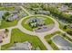 Beautiful aerial view of homes surrounding a cul-de-sac with well-kept lawns and a pool at 2726 Reflection Way, Greenwood, IN 46143