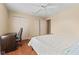 Bedroom with hardwood floors, ceiling fan, closet, and desk at 2726 Reflection Way, Greenwood, IN 46143