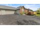 Charming single-story home features a brick facade, attached garage, and meticulously landscaped front yard at 2726 Reflection Way, Greenwood, IN 46143