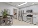 Kitchen with stainless steel appliances, granite countertops, and white cabinets at 2726 Reflection Way, Greenwood, IN 46143