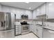 Updated kitchen with stainless steel appliances and modern cabinetry at 2726 Reflection Way, Greenwood, IN 46143