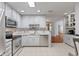 Modern kitchen with stainless steel appliances and white cabinets at 2726 Reflection Way, Greenwood, IN 46143