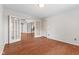 Bright living room with hardwood floors, french doors, and neutral paint at 2726 Reflection Way, Greenwood, IN 46143