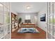 Well-lit office space with hardwood floors, a modern desk, and stylish shelving for organization at 2726 Reflection Way, Greenwood, IN 46143