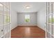 Bright and airy office space featuring hardwood floors, ample natural light, and versatile layout at 2726 Reflection Way, Greenwood, IN 46143