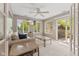 Bright and airy sunroom with tiled floors, lots of windows, and a sliding door leading to the patio at 2726 Reflection Way, Greenwood, IN 46143