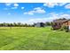 Spacious backyard showcasing a well-maintained lawn and outbuildings, perfect for outdoor activities at 2769 S 800 W, Indianapolis, IN 46239