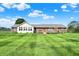 Expansive backyard featuring a well-manicured lawn, with large decks and a brick exterior home at 2769 S 800 W, Indianapolis, IN 46239