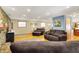 Another view of this comfortable living room, with stone fireplace and hardwood floors, and comfortable seating arrangement at 2769 S 800 W, Indianapolis, IN 46239