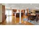 Bright and open living area featuring a spacious kitchen, dining area, and stone fireplace, creating a warm and inviting atmosphere at 2769 S 800 W, Indianapolis, IN 46239