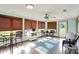 Bright sunroom with large windows, comfortable seating, and a ceiling fan, perfect for enjoying the outdoors indoors at 2769 S 800 W, Indianapolis, IN 46239