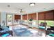 Bright sunroom with large windows, comfortable seating, and a ceiling fan, perfect for enjoying the outdoors indoors at 2769 S 800 W, Indianapolis, IN 46239