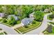 Stunning aerial view showcasing a well-maintained home on a corner lot, complemented by mature trees and a serene neighborhood setting at 3162 Hazel Foster Dr, Carmel, IN 46033