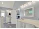 This bathroom features dual sinks, vanity lighting, and tile flooring at 3162 Hazel Foster Dr, Carmel, IN 46033