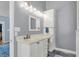 Bathroom with modern vanity, sink, and vanity lighting above mirror at 3162 Hazel Foster Dr, Carmel, IN 46033