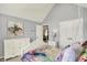 Bright bedroom with light gray walls and furniture, with an open door to another room at 3162 Hazel Foster Dr, Carmel, IN 46033
