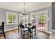Cozy dining area featuring hardwood floors, lots of natural light, and an adjacent deck, perfect for casual meals at 3162 Hazel Foster Dr, Carmel, IN 46033