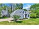 Charming home exterior featuring a well-kept lawn, mature landscaping, and an inviting driveway leading to an attached garage at 3162 Hazel Foster Dr, Carmel, IN 46033