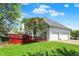 Back exterior elevation of a home featuring a 3-car garage and a deck at 3162 Hazel Foster Dr, Carmel, IN 46033