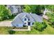 Striking home exterior with a well-manicured lawn, complemented by landscaped gardens and mature trees at 3162 Hazel Foster Dr, Carmel, IN 46033