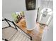 Bright foyer with hardwood floors, white trim, modern chandelier, and staircase with black banister at 3162 Hazel Foster Dr, Carmel, IN 46033