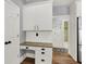 A bright kitchen features white cabinets, granite countertops, and stainless steel appliances at 3162 Hazel Foster Dr, Carmel, IN 46033