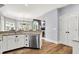 This kitchen features granite countertops, wooden floors, and stainless steel appliances at 3162 Hazel Foster Dr, Carmel, IN 46033