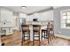 Modern kitchen with white cabinets, granite countertops, and stainless-steel appliances, creating a stylish culinary space at 3162 Hazel Foster Dr, Carmel, IN 46033