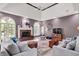 Spacious living room with fireplace, plush seating, and large arched windows letting in natural light at 3162 Hazel Foster Dr, Carmel, IN 46033