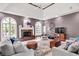 Inviting living room with a cozy fireplace, ample seating, and stylish décor, creating a warm atmosphere at 3162 Hazel Foster Dr, Carmel, IN 46033