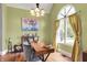 Charming office space featuring natural light from a large arched window and hardwood floors at 3162 Hazel Foster Dr, Carmel, IN 46033
