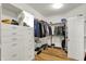Walk-in closet with custom built-ins and plenty of room for shoes, clothes, and accessories at 3162 Hazel Foster Dr, Carmel, IN 46033