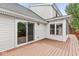 Backyard with a wooden deck, sliding glass door and a sunroom at 320 Thornberry Dr, Carmel, IN 46032