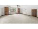 Bedroom features large window seat, neutral carpet, and access to two storage closets at 320 Thornberry Dr, Carmel, IN 46032