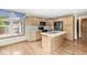 Well-lit kitchen with wooden cabinets, stainless steel appliances, and an island at 320 Thornberry Dr, Carmel, IN 46032
