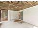 Covered patio with views to the sunroom, back door, and sliding glass door at 320 Thornberry Dr, Carmel, IN 46032