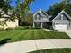 Charming two-story home with a well-manicured lawn and beautiful landscaping at 3243 Red Fox Trl, Columbus, IN 47201