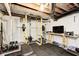 Basement gym equipped with a weight rack, weights, television and exercise equipment at 329 W Hampton Dr, Indianapolis, IN 46208