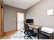 Bright home office with a modern desk, ergonomic chair, and access to the backyard at 329 W Hampton Dr, Indianapolis, IN 46208