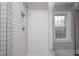 Close up of shower with white subway tiles, rain shower head, and built-in niche at 329 W Hampton Dr, Indianapolis, IN 46208