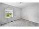 A cozy bedroom offering neutral walls, natural light, and plush grey carpeting at 3505 Autumn Ct, Columbus, IN 47203
