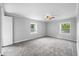 Spacious bedroom with two bright windows and a ceiling fan for added comfort at 3505 Autumn Ct, Columbus, IN 47203