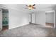 A generous bedroom offering a ceiling fan and access to the bathroom at 3505 Autumn Ct, Columbus, IN 47203
