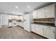 Bright kitchen featuring white cabinetry, updated countertops, and a matching backsplash, creating a clean design at 3505 Autumn Ct, Columbus, IN 47203