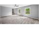 Bright living room with soft gray walls, cozy carpeting, and natural light streaming in through the windows at 3505 Autumn Ct, Columbus, IN 47203