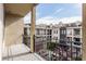 Balcony with views of neighboring buildings, outdoor space, and a metal railing at 355 E Ohio St # 314, Indianapolis, IN 46204