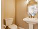 Powder room with neutral walls and a pedestal sink at 355 E Ohio St # 314, Indianapolis, IN 46204