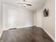 Bedroom with hardwood floors and a ceiling fan features a wall-mounted television at 355 E Ohio St # 314, Indianapolis, IN 46204