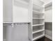 Walk-in closet with white shelving provides ample storage space for clothing and accessories at 355 E Ohio St # 314, Indianapolis, IN 46204