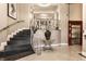 Staircase in a grand entryway with elegant railings, tile floors, and an elevator at 355 E Ohio St # 314, Indianapolis, IN 46204